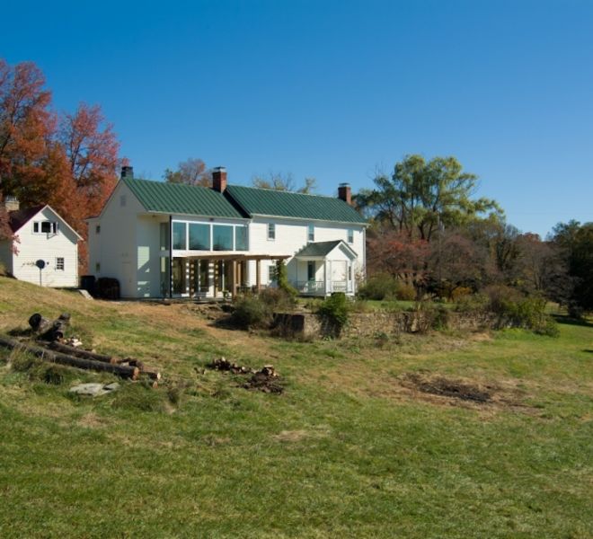 Glass Room On Log House exterior full shot of home