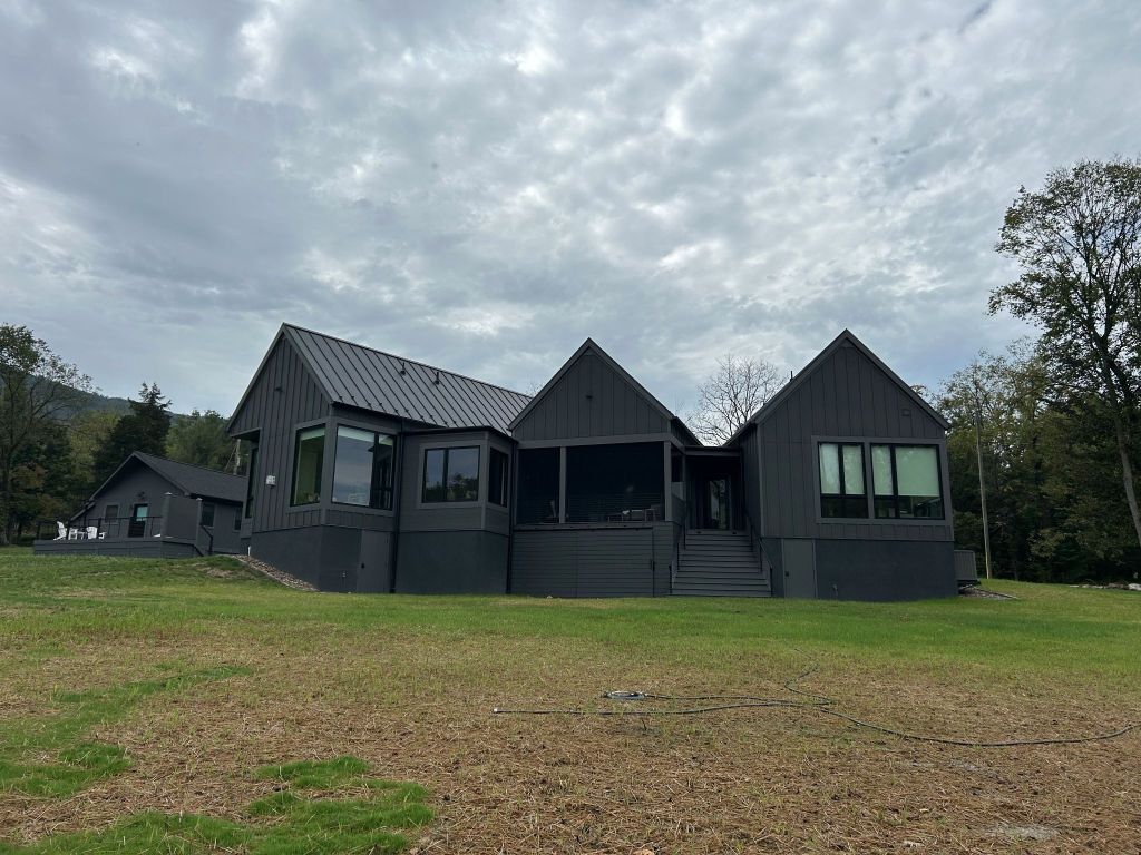 Rear view of modern full black exterior house.