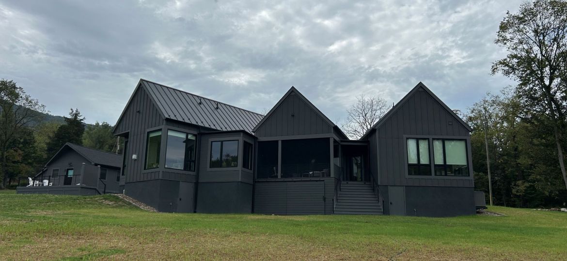 Rear view of modern full black exterior house.