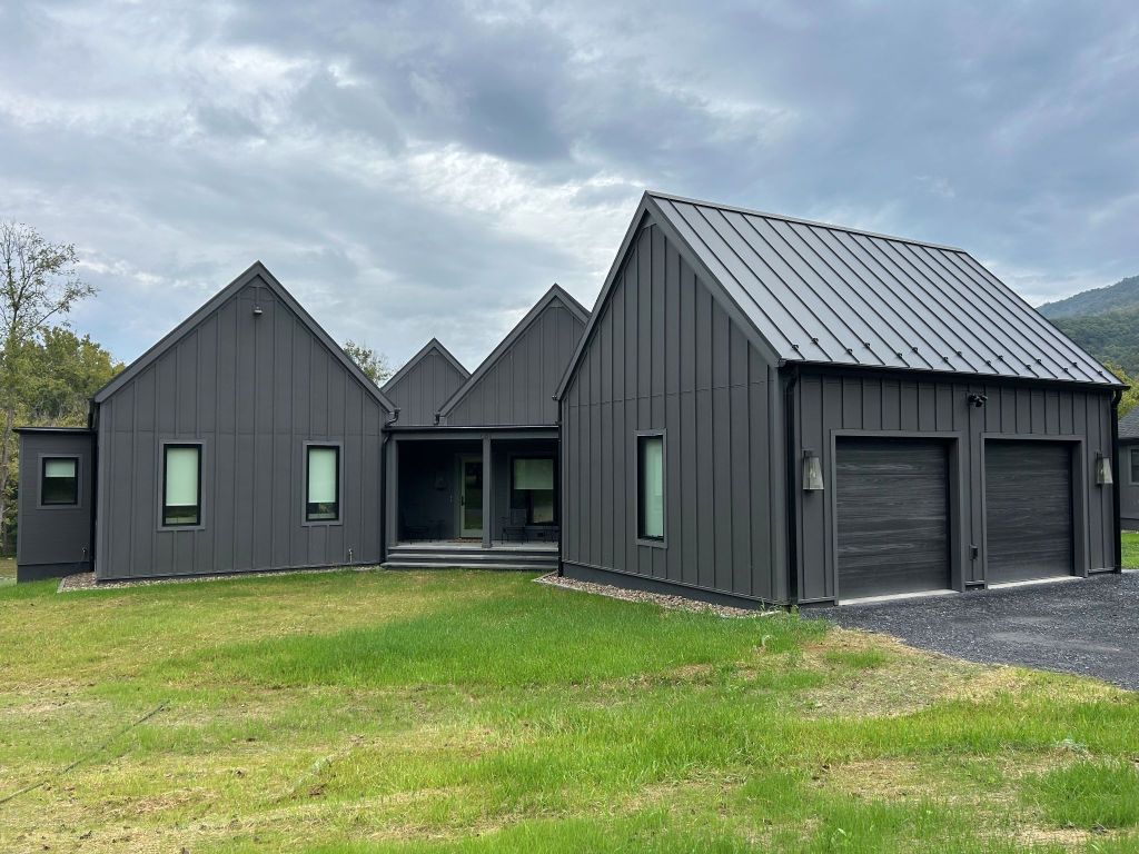 Front view of modern full black exterior house.
