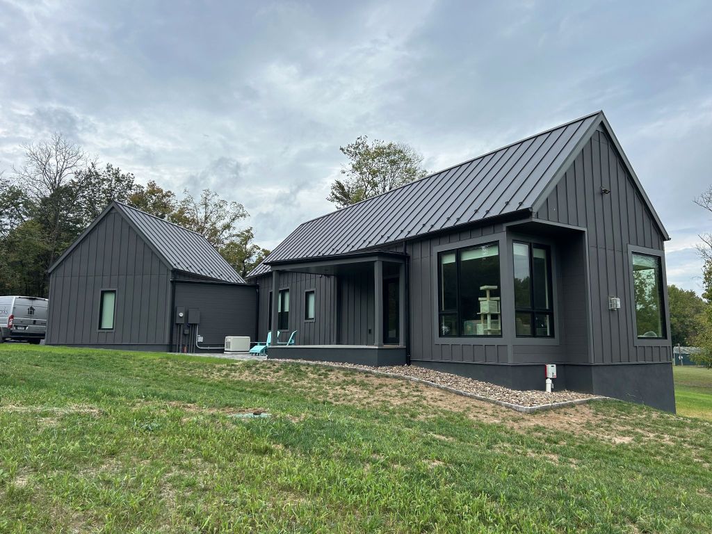 Side view of modern full black exterior house.