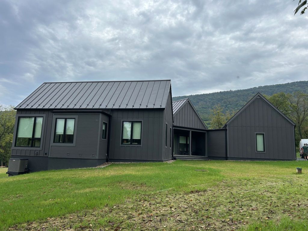 Side view of modern full black exterior house.